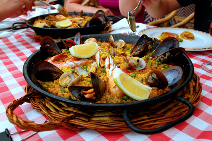 Soak up the flavors of Paella: saffron, rosemary, olive oil, and seafood